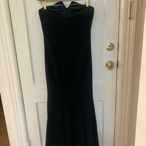 Full length black formal strapless gown worn once. Size 6.